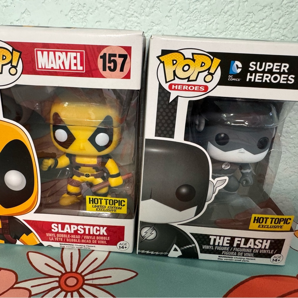 Marvel slap stick (Deadpool) and DC flash Funko Pop